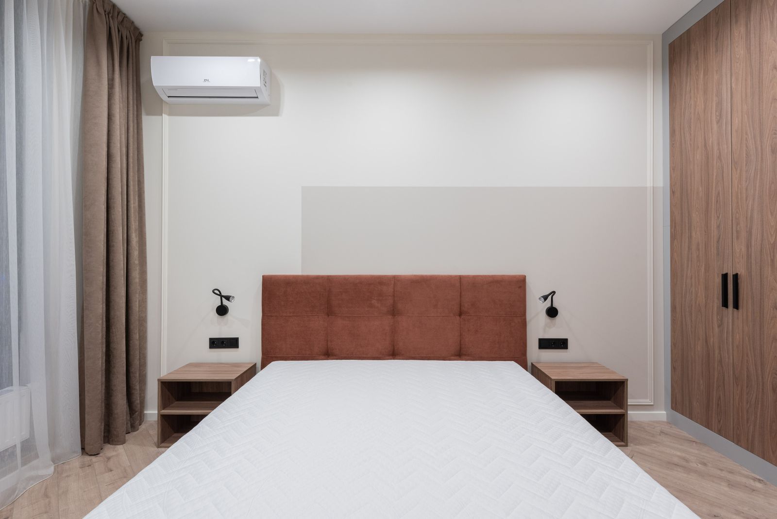 Bedroom wardrobe in a 3 BHK Sarjapur Road apartment 2026, wooden finish with bedside units by myNivasa