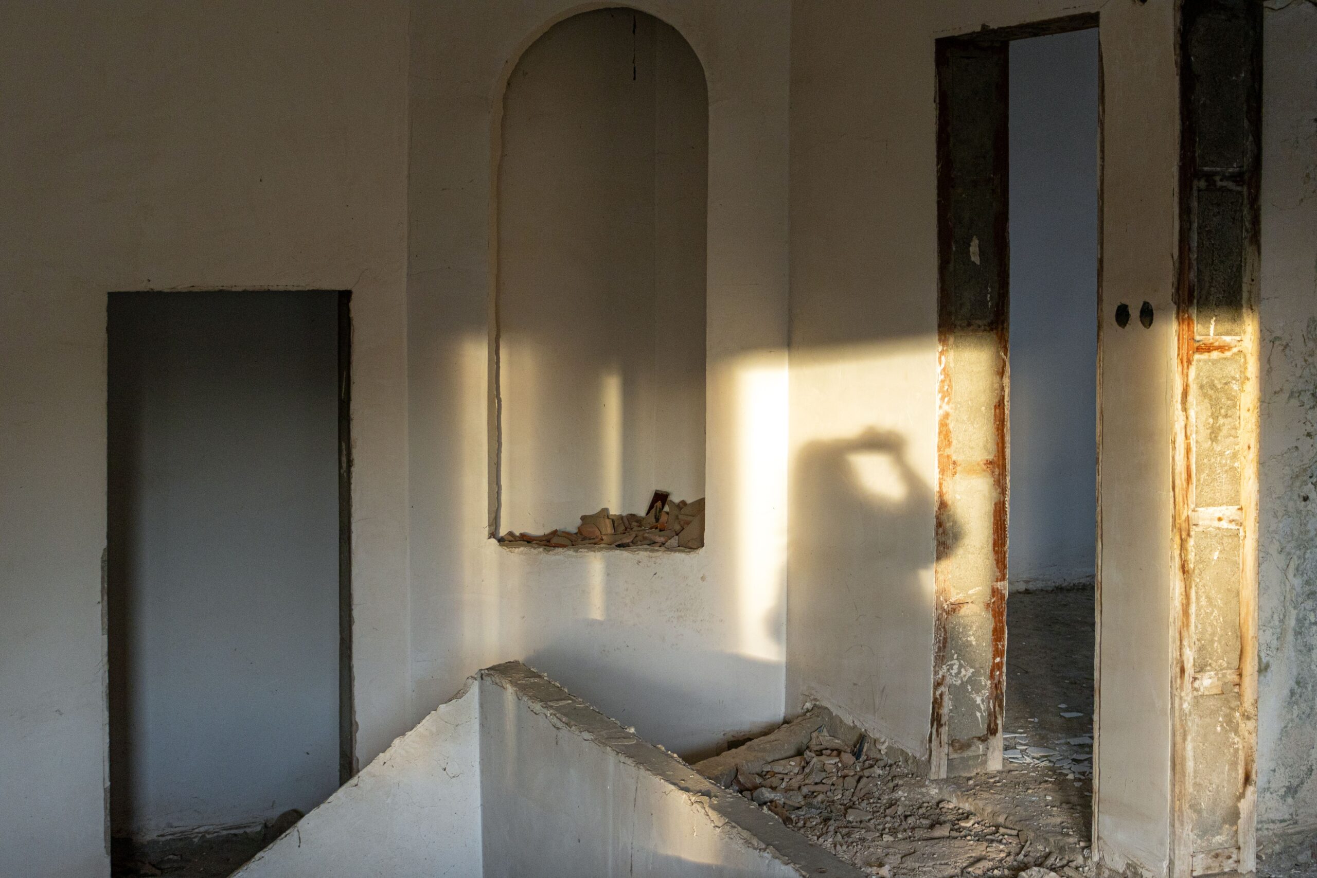 Arched niche and opened doorways during home renovation demolition in Bangalore 2026 by myNivasa