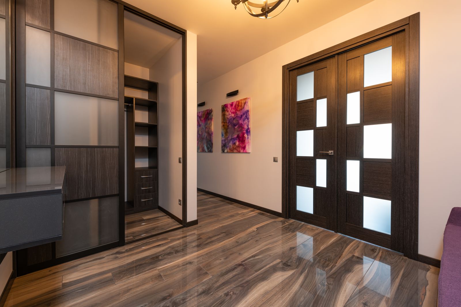 Sliding wardrobe doors with frosted glass and laminate finish over laminate flooring in Bengaluru 2026 by myNivasa