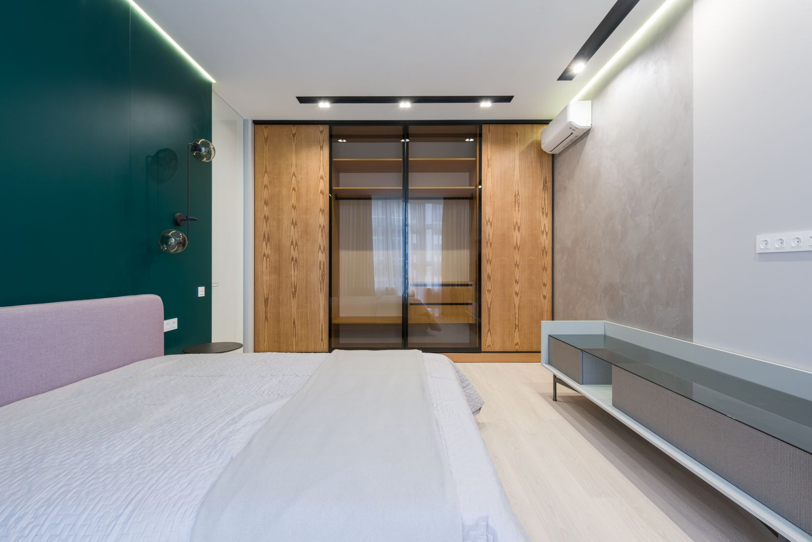 Guest room wardrobe cost in Bengaluru 2026 showing sliding laminate shutters on BWP plywood core