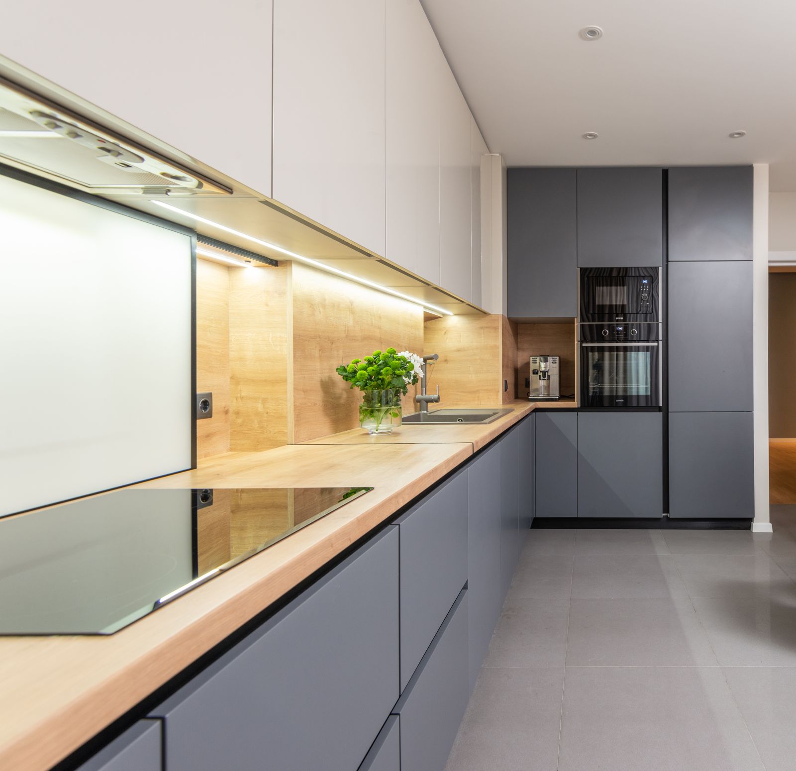 Slim built-in chimney hood in a galley modular kitchen in Bengaluru 2026 by myNivasa