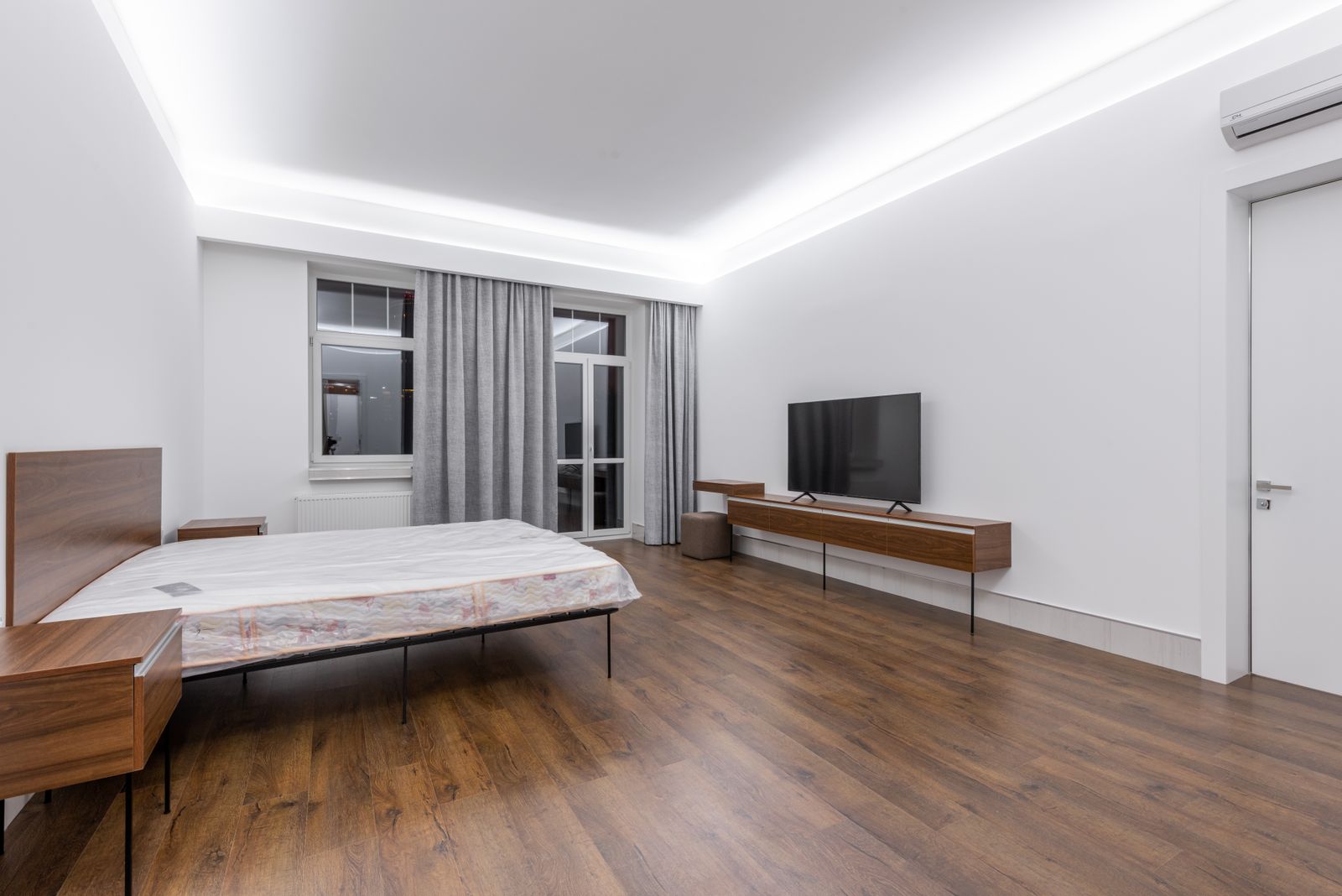 Bengaluru bedroom with a peripheral border false ceiling and cove lighting leaving the centre at full slab height, 2026, by myNivasa