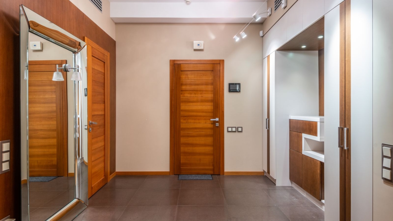 Apartment entrance hall with laminated flush doors and teak chowkat frames, internal door replacement project in Marathahalli Bengaluru 2026 by myNivasa