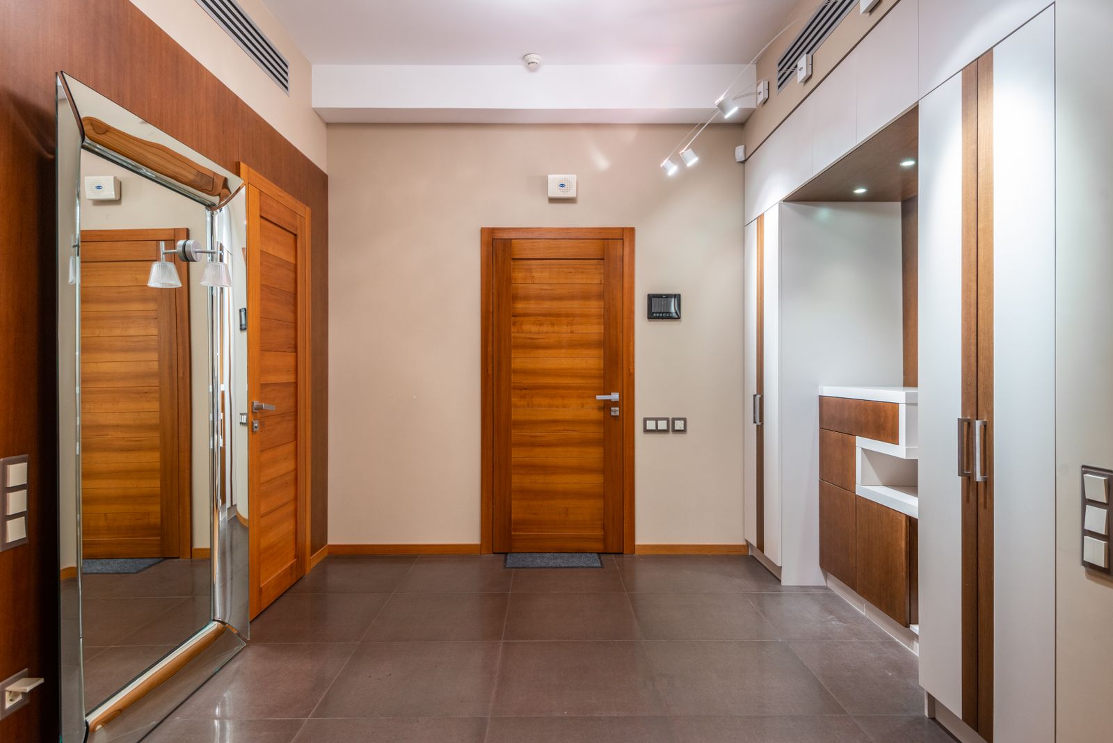 Apartment entrance hall with laminated flush doors and teak chowkat frames, internal door replacement project in Marathahalli Bengaluru 2026 by myNivasa