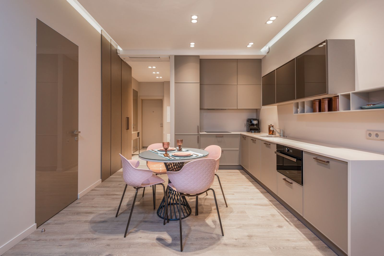 Floor to ceiling kitchen tall unit column beside a compact dining area in an apartment kitchen, kitchen tall unit cost Bengaluru 2026, by myNivasa