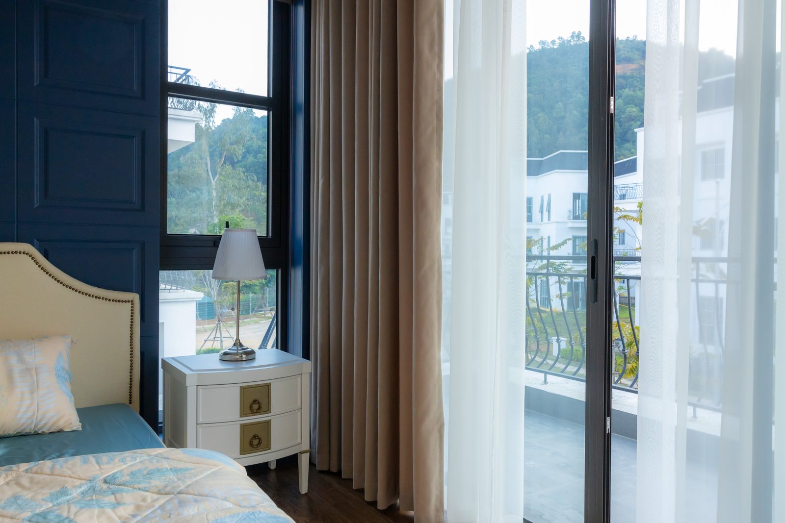 Bedroom window and balcony slider in a Bengaluru apartment before uPVC replacement, 2026, by myNivasa