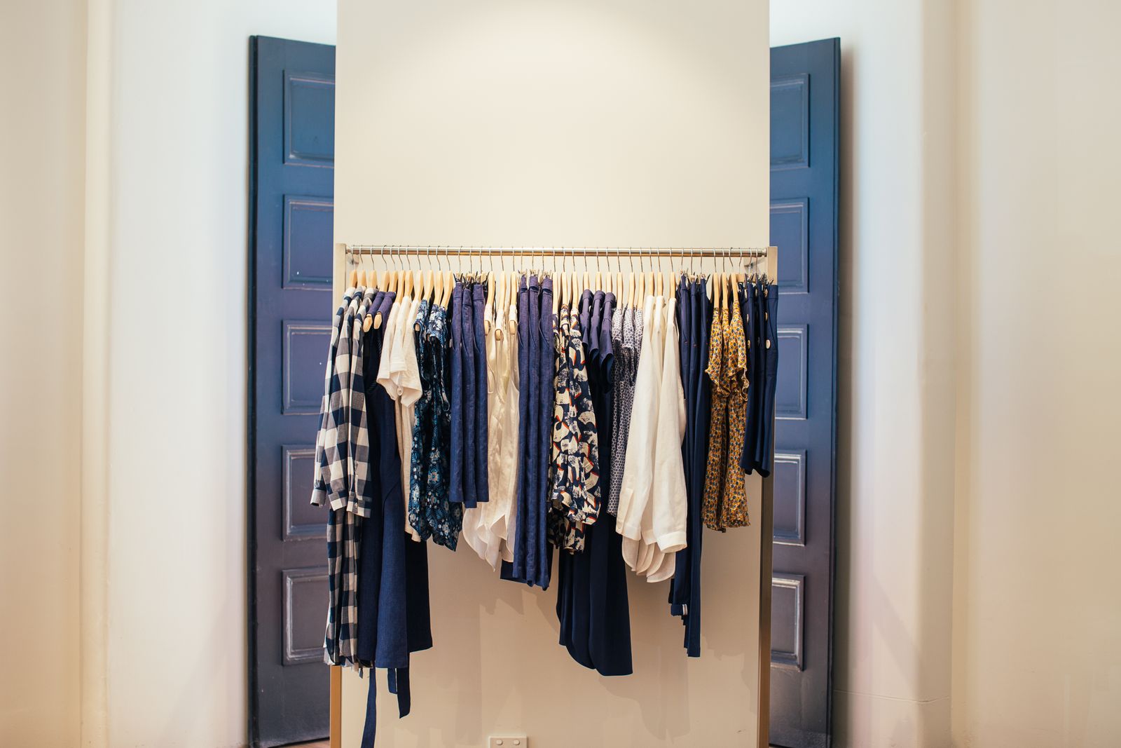 Full width clothes rail inside a bedroom wardrobe recess showing short hang clear drop, wardrobe rod height Bengaluru 2026 by myNivasa