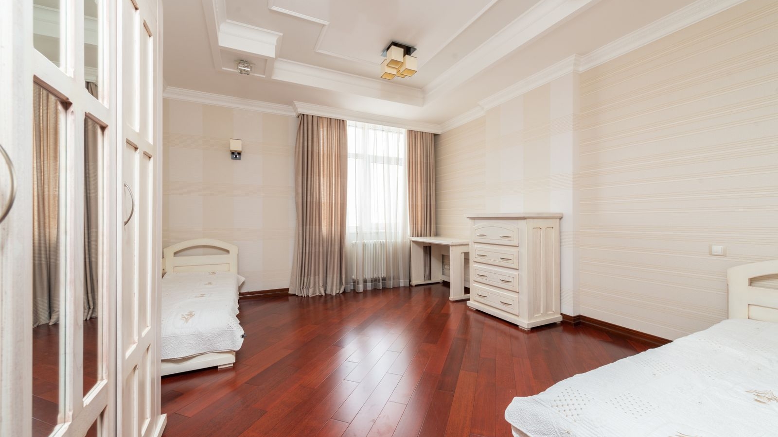 Bengaluru bedroom with dark wooden plank flooring, wardrobe and window, interior design 2026 by myNivasa
