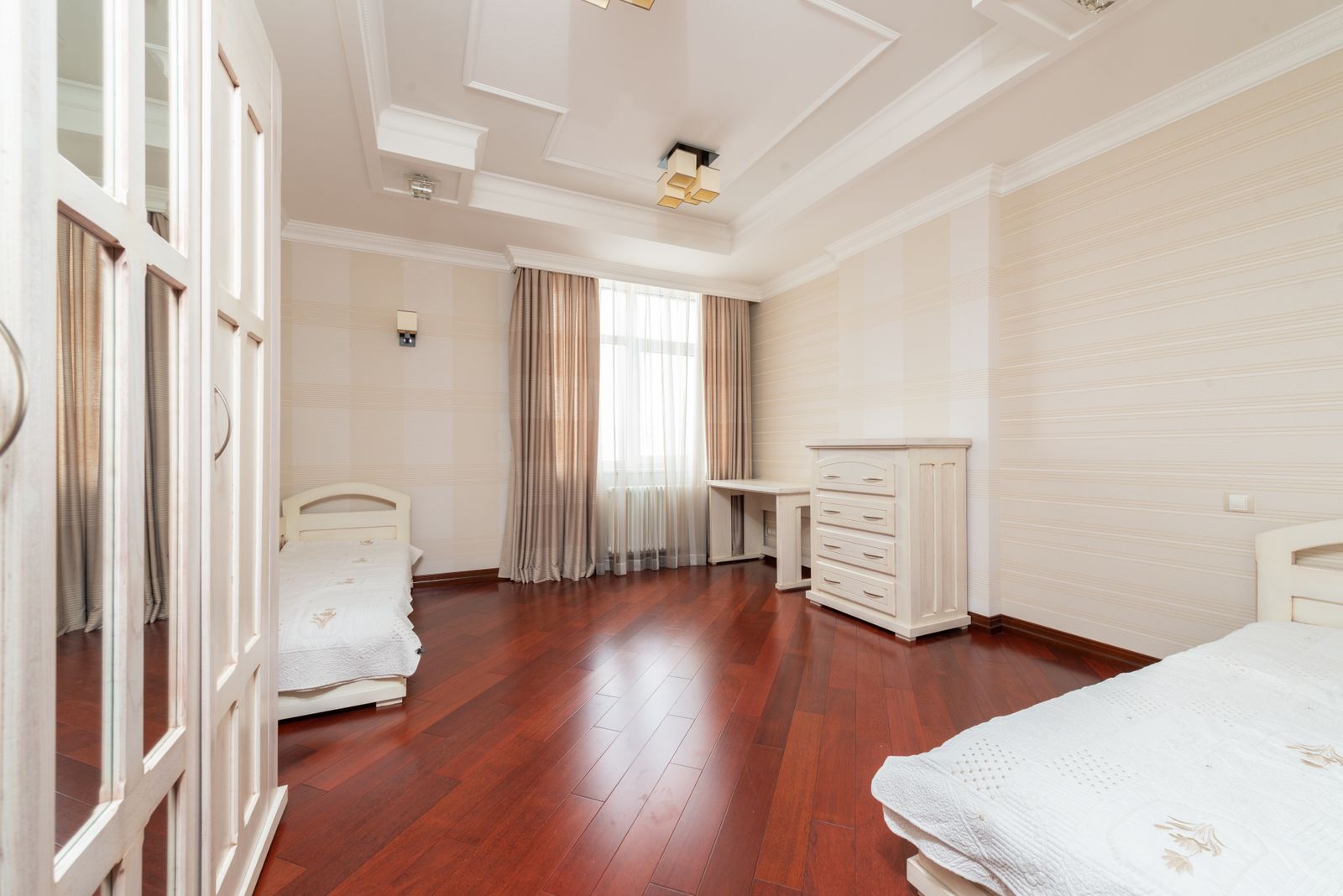Bengaluru bedroom with dark wooden plank flooring, wardrobe and window, interior design 2026 by myNivasa